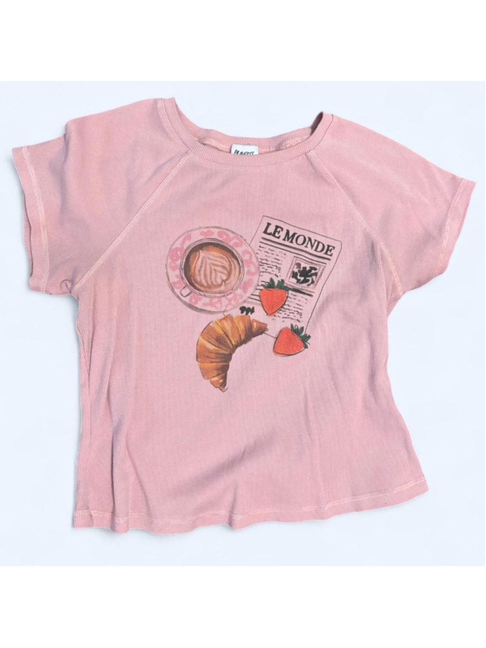 Pink Princess Polly cropped top with graphic of a croissant, strawberries, and a